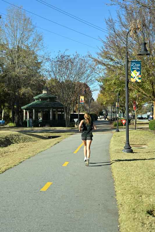 Girl running on trail in Travelers Rest