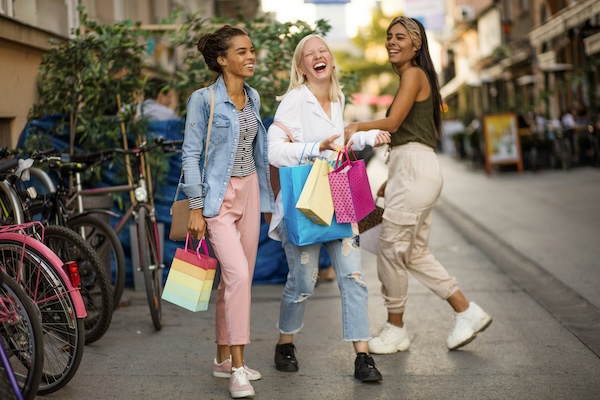 three women shopping and laughing