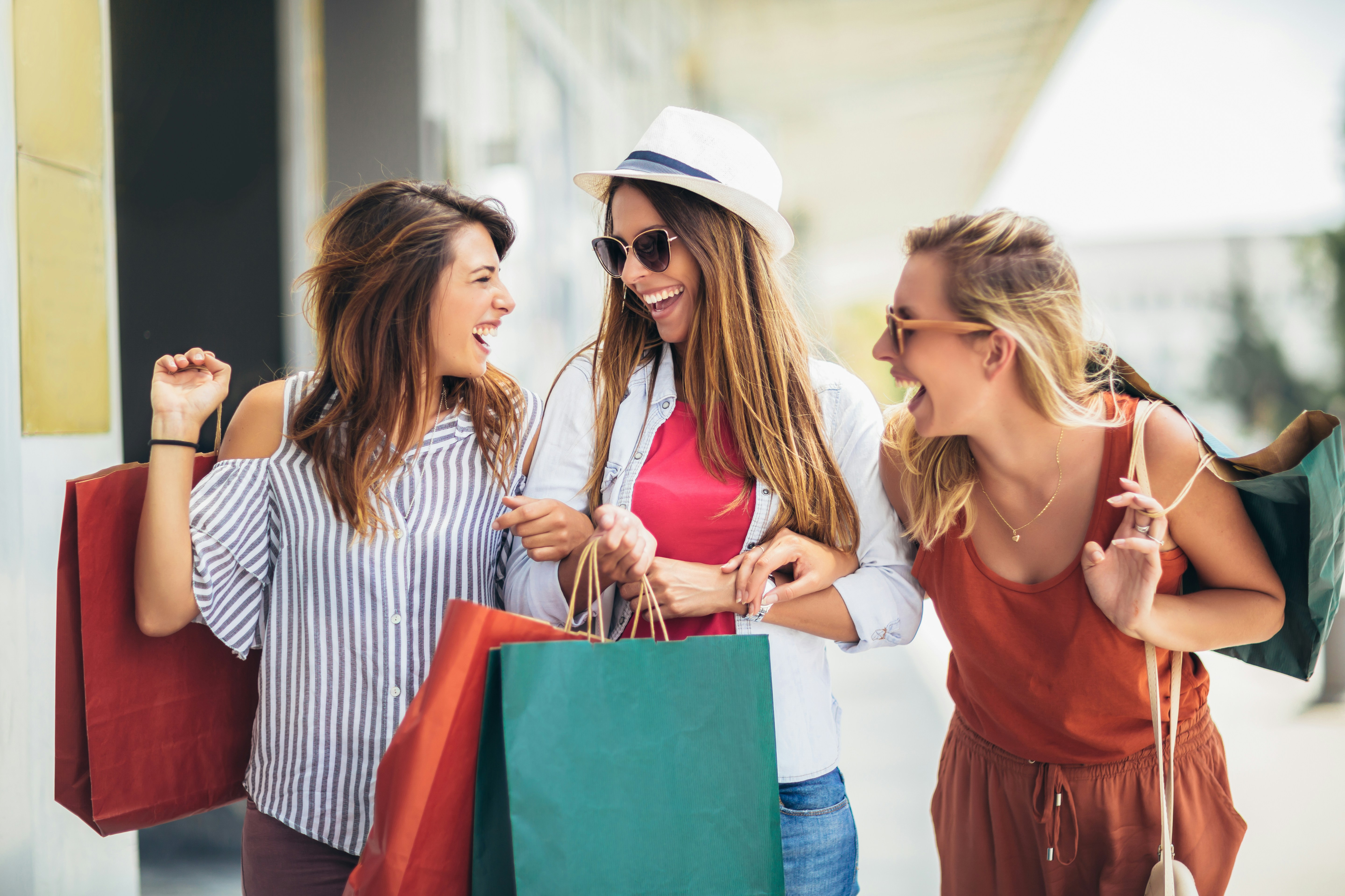 two women shopping and laughing